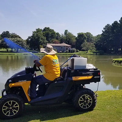Spraying a pond for weed control
