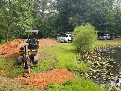 Trenching to the edge of a pond