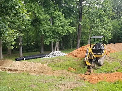 Digging trenches for inflow and outflow pipes